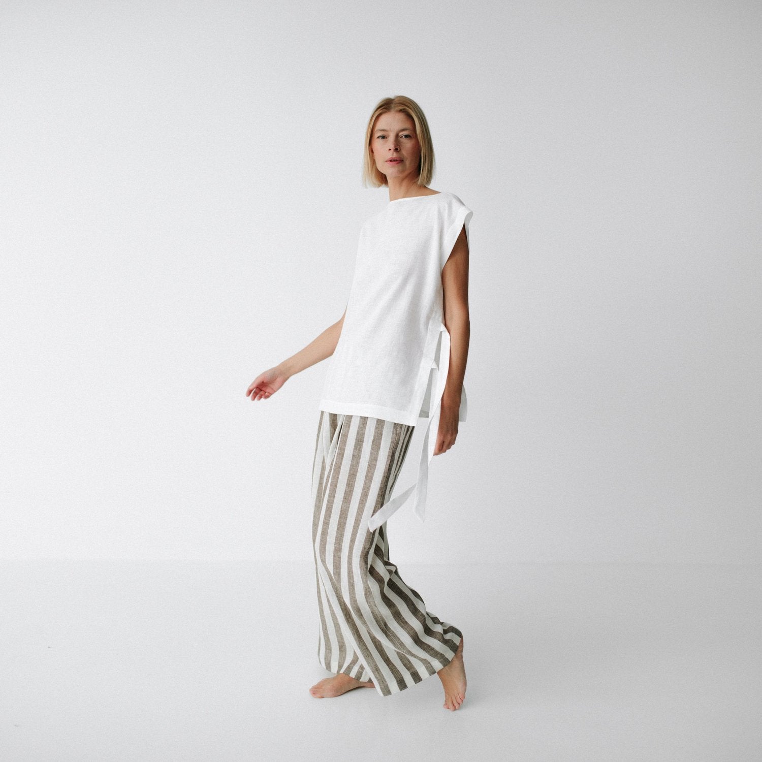 https://images.squarespace-cdn.com/content/v1/5994273337c5815907f65fce/22fc5bf8-ef77-4299-b47c-c2a1ef1f88e0/linen-pants-brown-stripes-1.jpg?format=1500w