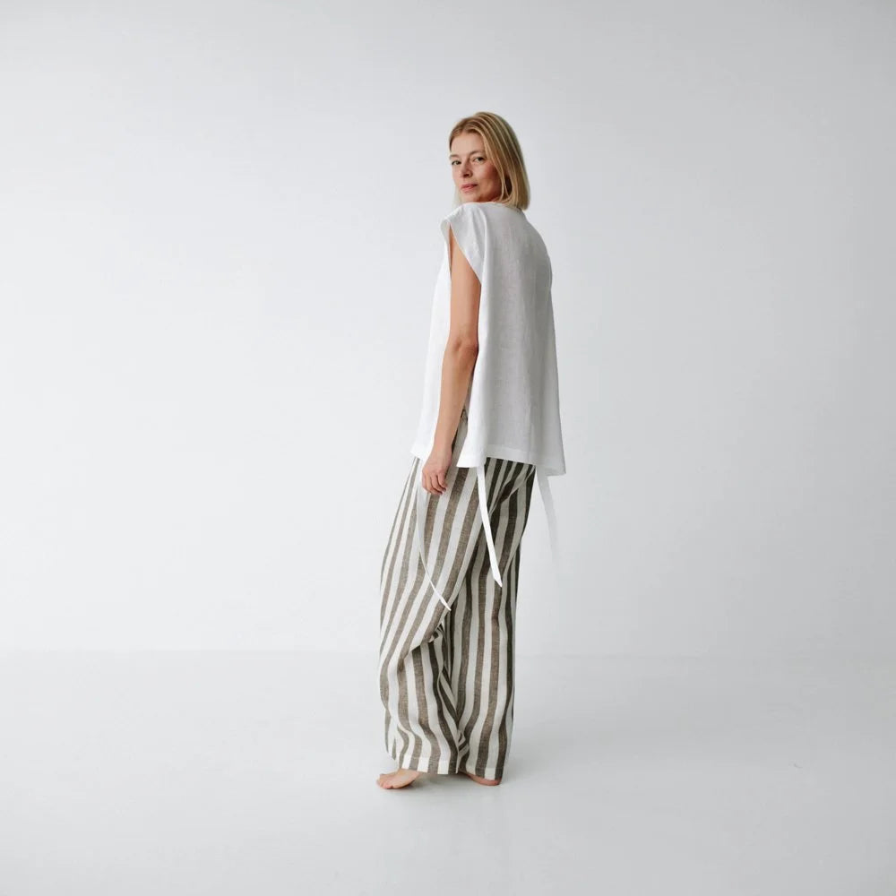 https://images.squarespace-cdn.com/content/v1/5994273337c5815907f65fce/1fef6f77-a1df-45e1-9820-41ead70ad0ed/linen-pants-brown-stripes-3.jpg?format=1500w